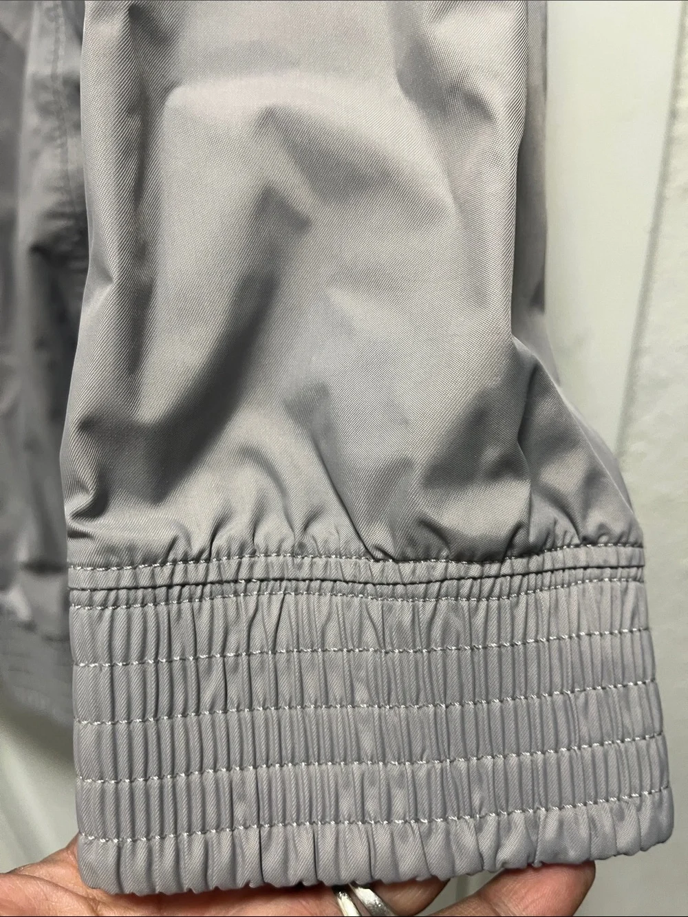 The North Face Light Gray women’s' Hooded Rain Jacket